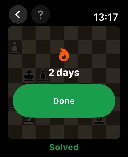 A solved puzzle on the watch showing a two-day streak and a Done button